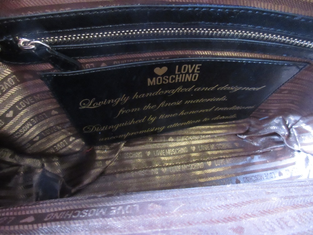 Love Moschino, red leather handbag having pocket to front with silver metal padlock style clasp - Image 4 of 4