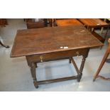 18th Century oak side table with a moulded plank top above a single frieze drawer raised on turned