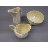 Belleek shell form sugar bowl and cream jug and a Royal Worcester leaf form jug
