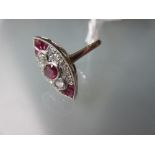 Platinum, ruby and diamond marquese shaped panel ring