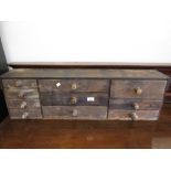 19th Century pine bank of ten drawers with knob handles 11ins high x 36ins wide x 7ins deep Estimate