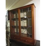 Edwardian mahogany dentistry cabinet having two glazed doors with later leading and two short
