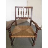 Oak spindle back armchair with rush seat and a Victorian walnut and parquetry inlaid box