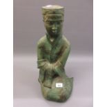 Green patinated terracotta figure of a seated Oriental girl