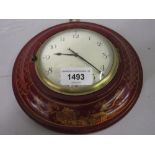 Circular red chinoiserie lacquer cased Sedan clock, the painted dial with Arabic numerals, with