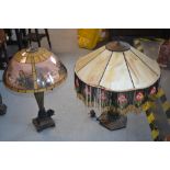 20th Century bronzed metal lamp base with Tiffany style shade, together with another similar lamp