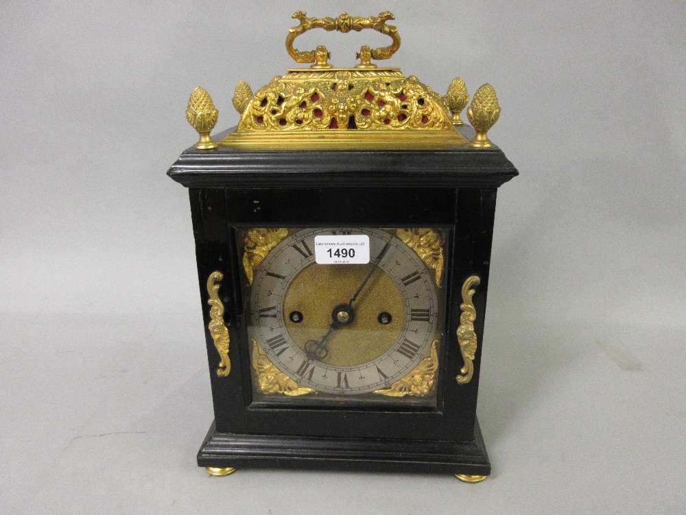 Small 18th Century ebonised and gilt brass table or bracket clock, the gilt basket top and acorn