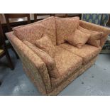 Peter Guild Parker Knole type sofa, having floral rust coloured damask upholstery with loose