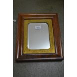 19th Century rosewood moulded rectangular picture frame with gilt metal mount and later added