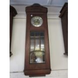 Early 20th Century Continental mahogany cased wall clock of Vienna type, the rectangular case with a
