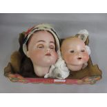 Simon and Halbig K. and R. bisque doll's head, size 70 with sleeping eyes, together with a similar