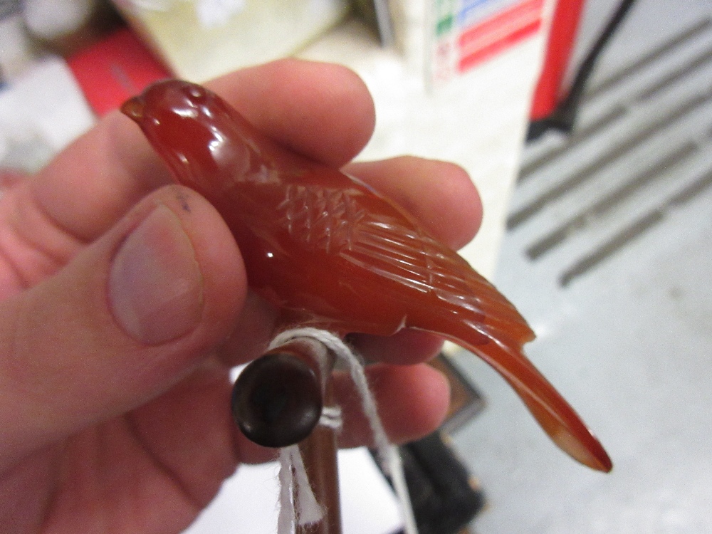 Carved hardstone figure of a bird on a wooden perch, three similar figures of fish - Image 5 of 11