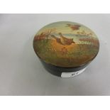 Russian circular papier mache box, the cover painted with game birds in a landscape, signed