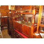 Victorian mahogany buffet with two panel doors raised on low turned feet