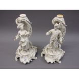 Pair of Naples white porcelain candlestick/comport bases in the form of a lady and gentleman (at