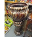 Large terracotta jardiniere on stand, simulated as brown marble. Various chips and grazing as