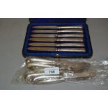 Set of six silver handled pistol grip dessert knives and forks and a cased set of six silver handled