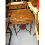 Edwardian mahogany and satinwood crossbanded envelope card table with single drawer having brass