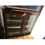 1920's Mahogany two door bow fronted display cabinet on claw and ball feet