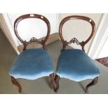 Pair of Victorian walnut balloon back side chairs with carved centre rails, two mahogany chairs, a