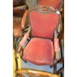 Pair of 19th Century French mahogany and upholstered open elbow chairs with scroll arms raised on