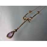 Delicate Edwardian yellow metal amethyst and split pearl pendant of bow and drop design