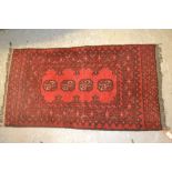 Small rug having four central gols with multiple borders on a wine ground, 3ft x 1.5ft