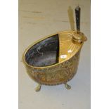 Victorian embossed brass coal scuttle on claw supports with integral shovel