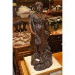 19th Century dark patinated bronzed figure of a woman playing a lute on a naturalistic base, 21ins