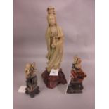 Chinese carved soapstone figure of a standing immortal together with a similar pair of smaller