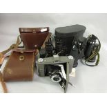 Two cased pairs of binoculars together with a Ross Ensign camera
