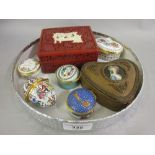 Group of five Halcyon days enamel boxes, gilt metal trinket box with porcelain inset lid and a red