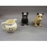 Two figures of dogs for Black and White Whisky advertising, together with a whisky related jug