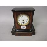 Small walnut and ebonised mantel clock with enamel dial, Roman numerals and single train movement