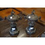 Pair of late 19th / early 20th Century French brown patinated bronze covered urns on circular