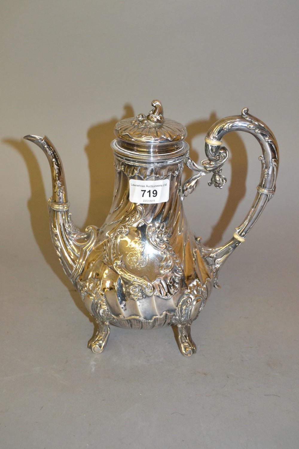 19th Century Continental silver coffee pot of wrythen fluted design, 9.5ins high