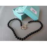 Tiffany & Co. black bead necklace with silver clasp, in original bag and box