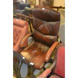 20th Century brown leather upholstered revolving office armchair Wear to arms and seat, loss of