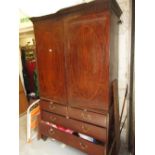 19th Century mahogany linen press having a moulded cornice above two flush panelled oval crossbanded