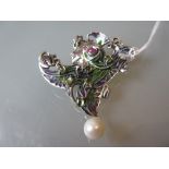Art Nouveau style brooch set with enamel, peridot, rubies and a pearl