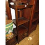 20th Century Chinese elm whatnot with three shelves above two small drawers, two doors, raised on