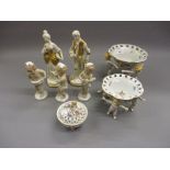 Two Continental porcelain floral decorated dishes, each supported by standing figures, a similar box