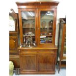 Victorian mahogany bookcase, the moulded cornice above a pair of glazed doors, two drawers and two