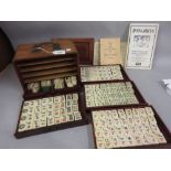 Chinese hardwood cased Mahjong set having bone and bamboo counters by Jackpot, having brass