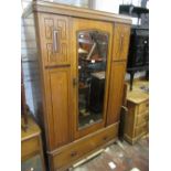 1930's Oak bedroom suite comprising: a single door wardrobe, dressing chest and bedroom chest