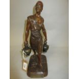 Marcel Debut, brown patinated bronze figure of a Tunisian water carrier, signed in the bronze, 12.