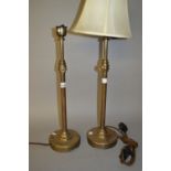 Pair of adjustable brass table lamps and a similar standard lamp (table lamps both at fault)