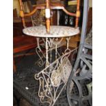 Small circular metal garden table and a pair of matching folding chairs
