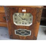 Art Deco walnut cased wall clock, the silvered dial with Arabic numerals signed ' Annick Girod Label