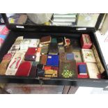 Table top glazed display cabinet containing various miniature books etc
